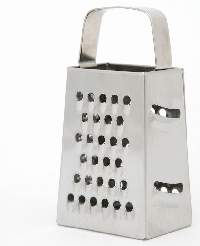 Use the coarse shred holes of the grater to shave the ice.