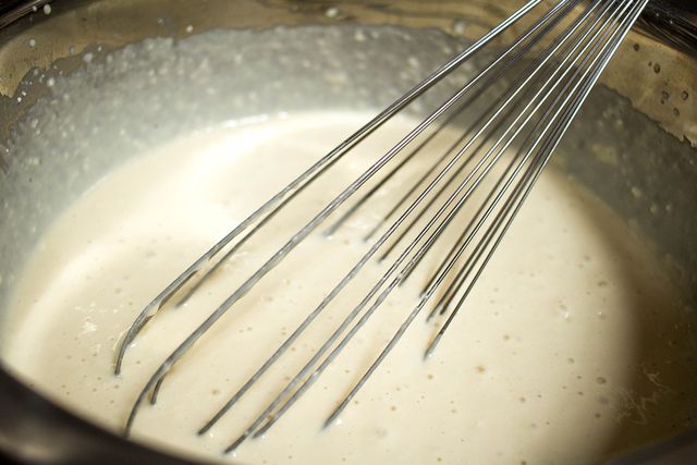 Whisk the mixture until it thickens.