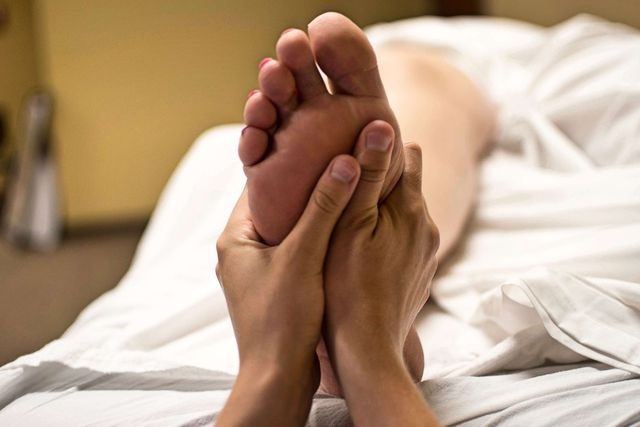 A quick foot massage can help stimulate blood flow. 