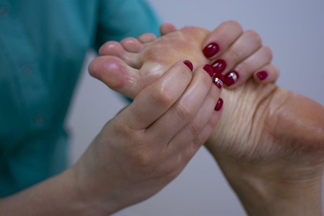 Massage around varicose veins to stimulate blood flow.