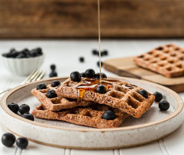 You can top your vegan waffles with your choice of fruits, syrups and nuts.