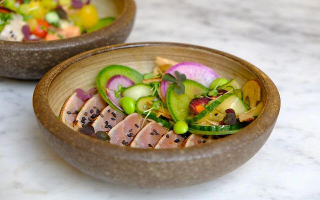 Pescatarians can enjoy healthy, colorful dishes like poke bowls. 