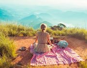 Becoming minimalist woman mountain picnic